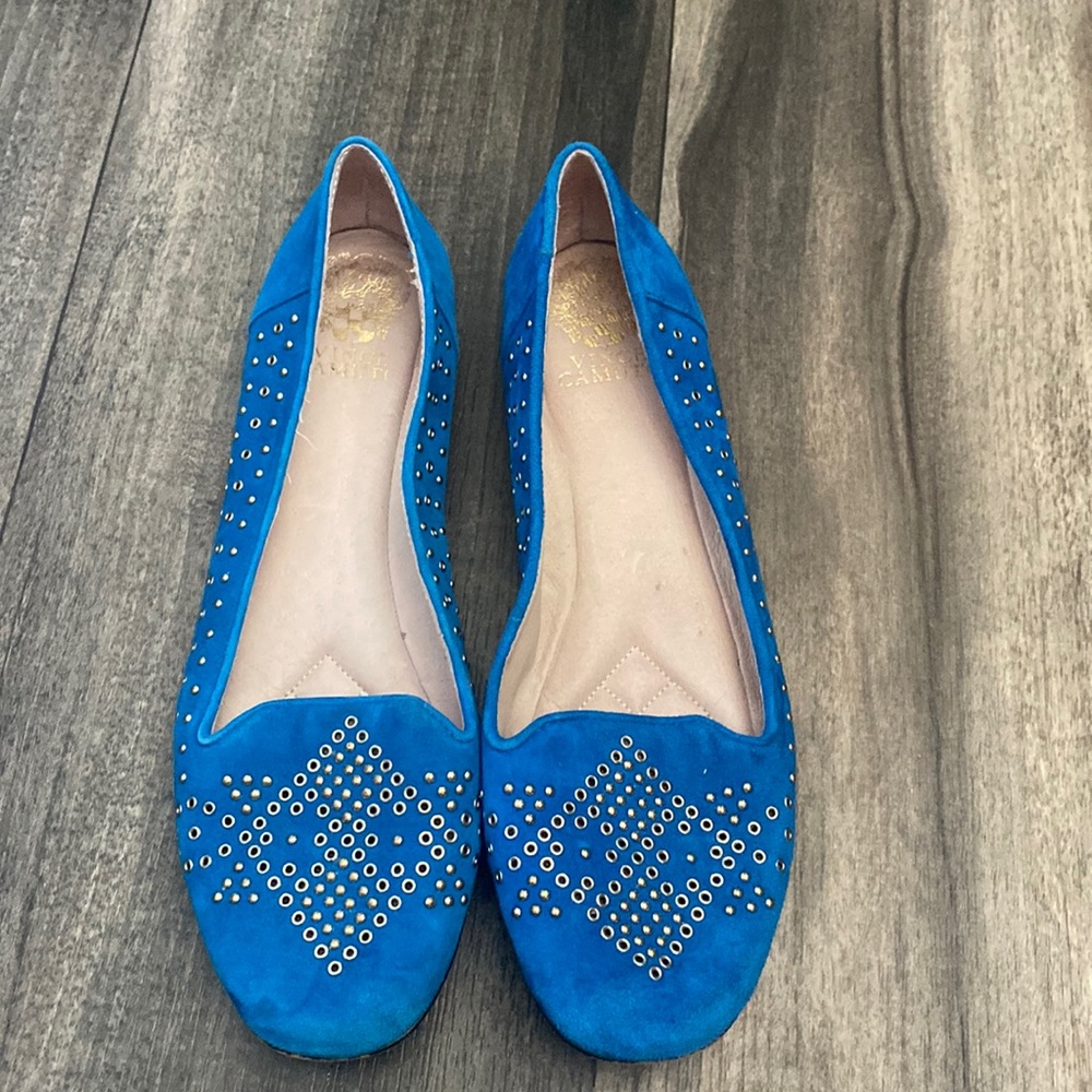 Vince Camuto blue suede flats with metal embellishments.
